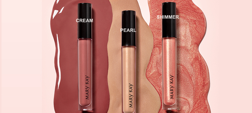 Three shades of new Mary Kay Unlimited™ Lip Gloss, one each in cream, pearl and shimmer finishes.