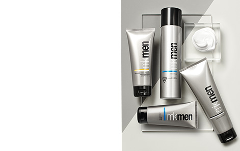 Mary Kay MKMen® Regimen products styled against a silver and white background atop a clear rectangle. White product smear is featured within a clear square. 