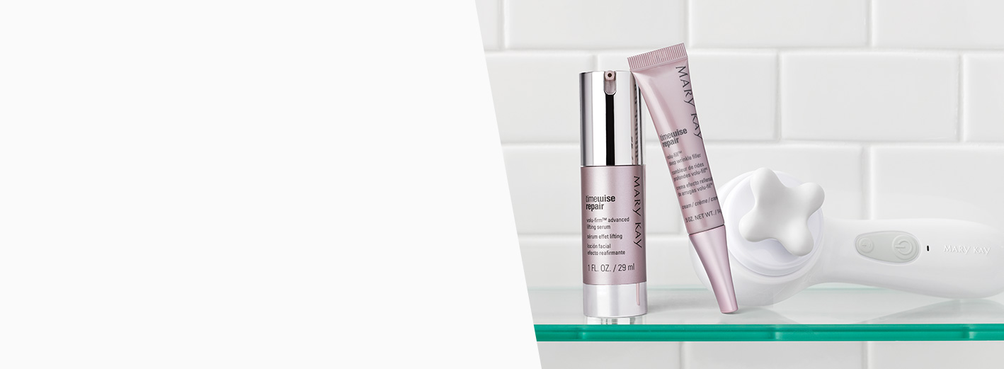 TimeWise Repair® Volu-Firm® Advanced Lifting Serum and TimeWise Repair® Volu-Fill® Deep Wrinkle Filler are shown on a shelf along with the Skinvigorate Sonic™ device and facial massage head.