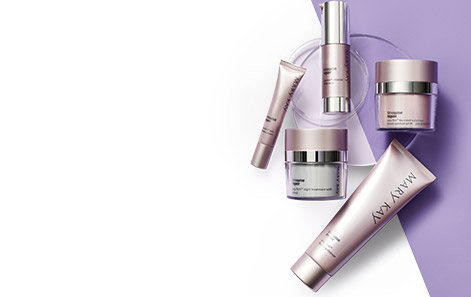 Mary Kay TimeWise Repair® Volu-Firm® Set products displayed against a purple background atop two clear discs.