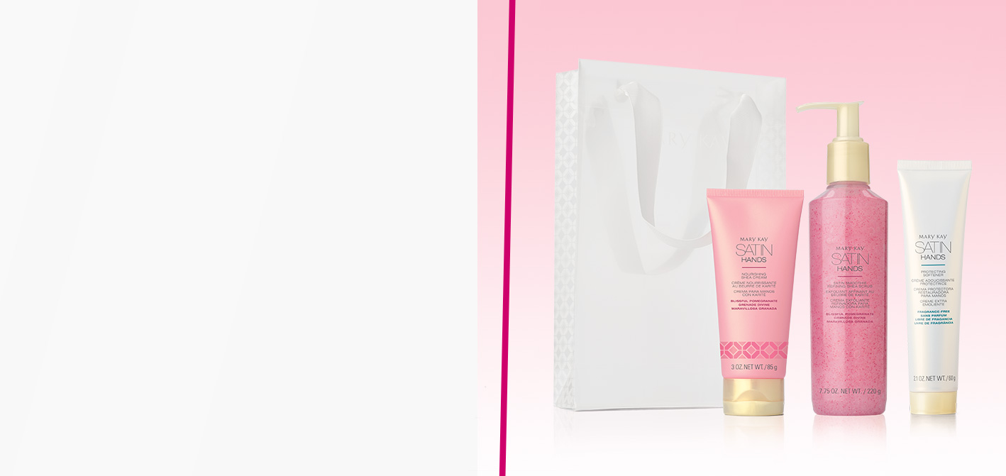 Limited-edition Blissful Pomegranate Satin Hands® Pampering Set next to accompanying bag against light pink background 