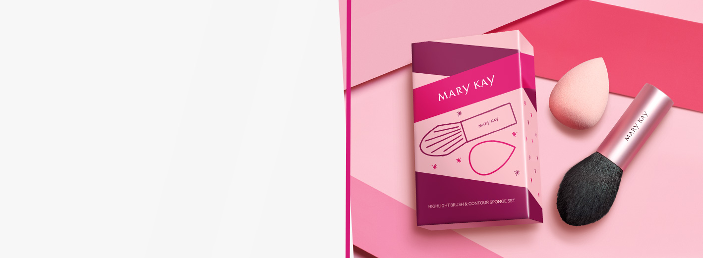 Limited-edition Mary Kay® Highlight Brush & Contour Sponge Set next to packaging against pink gradient background