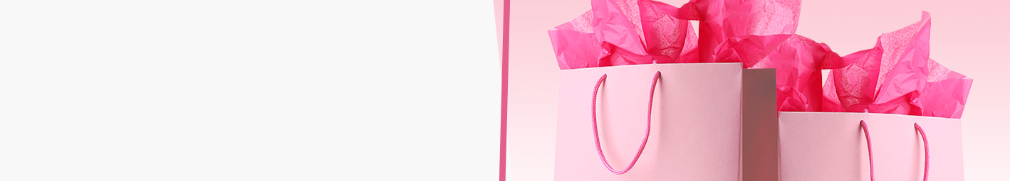 Two pink gift bags on a pink background