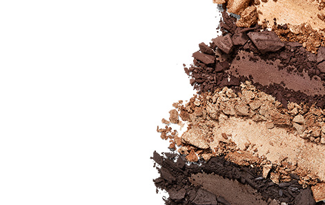Close-up of product crumbles of Mary Kay® products