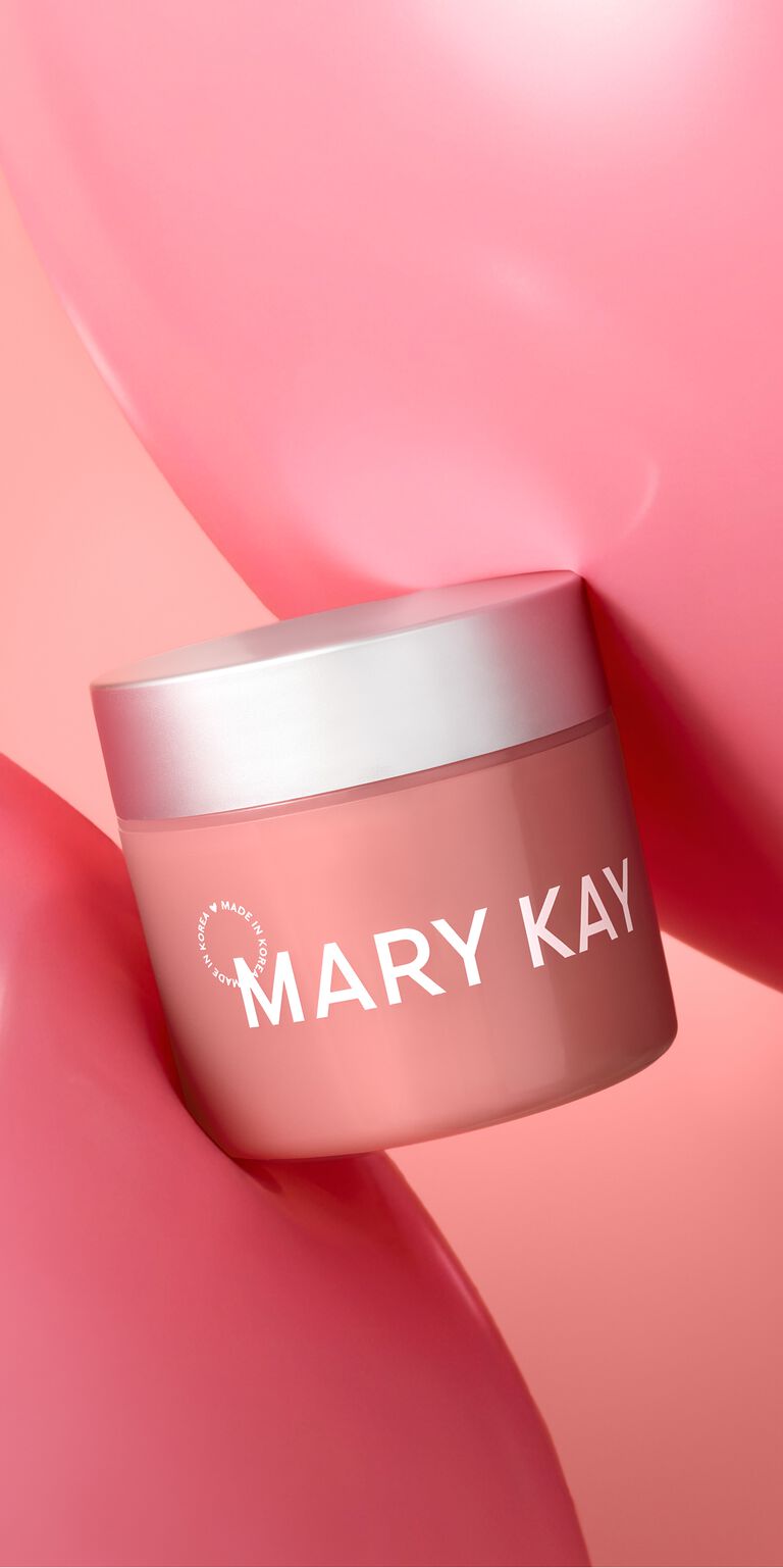 Frasco de Mary Kay Collagen Moisturizing Gel colocado entre dos muestras de gel rosa.