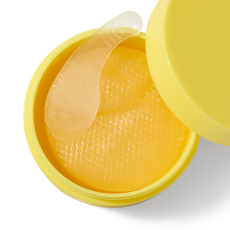 Closeup of Mary Kay Snail Gel Face Patches in yellow jar with spatula