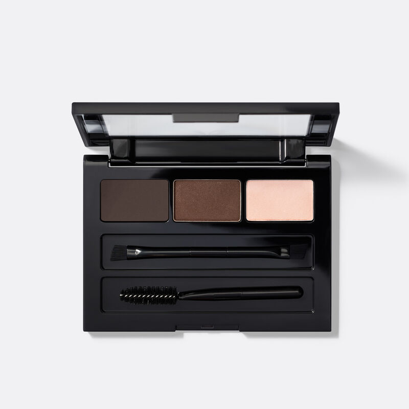 An open compact of limited-edition Mary Kay Brow Kit in shade Dark Brunette against plain background
