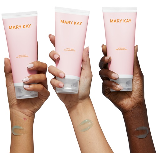 Hands holding a collection of After-Sun Replenishing Gel products