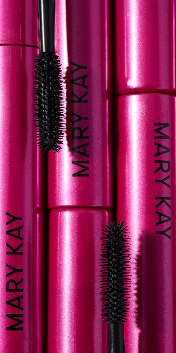 A close up of a woman's face with eye cream.